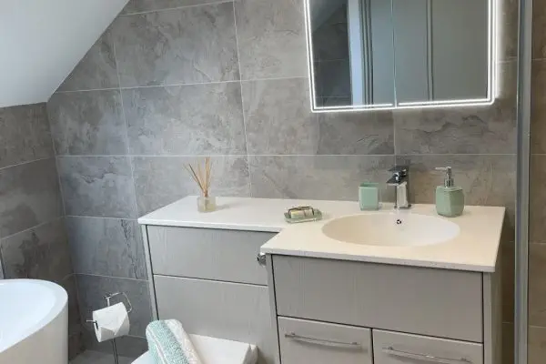 Large loft bathroom with freestanding bath, fitted furniture and walk-in shower_0752 (Large)